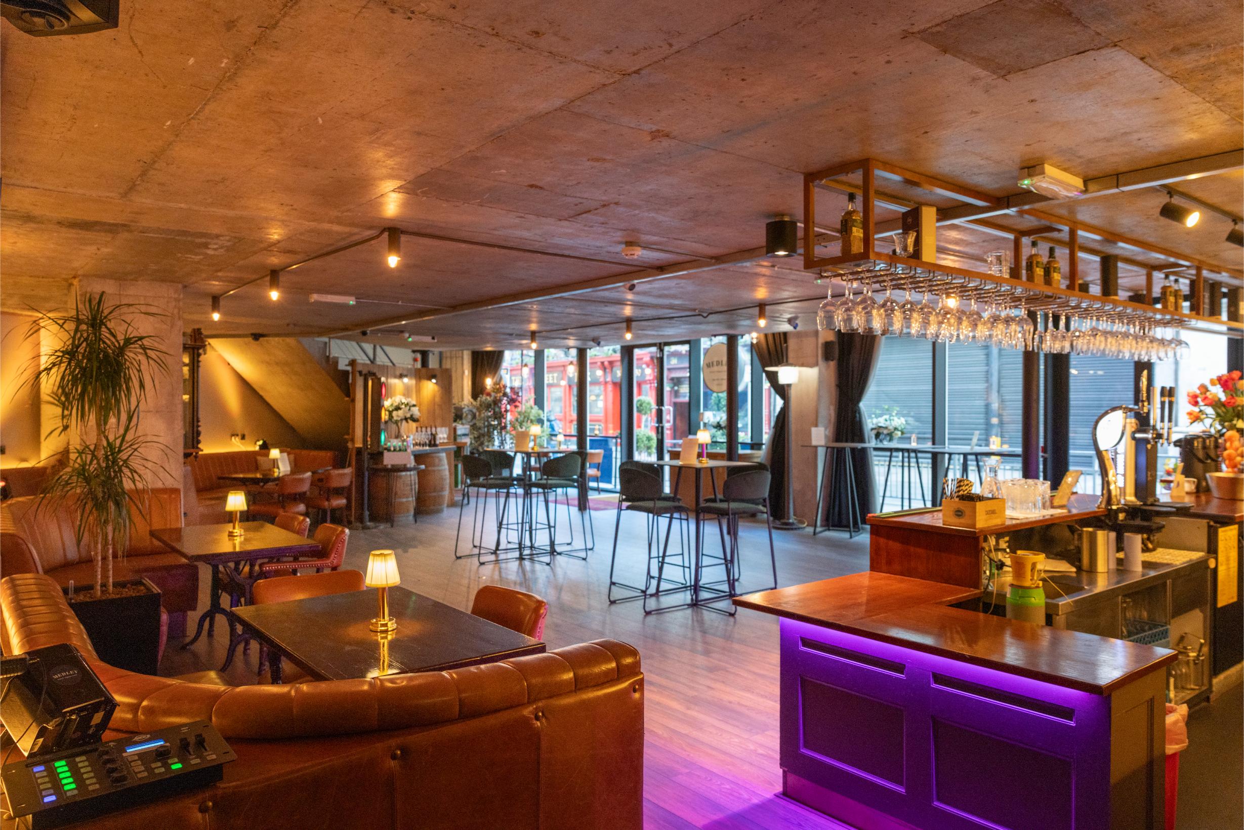 Medley's ground-floor bar and lounge under warm pendant lighting