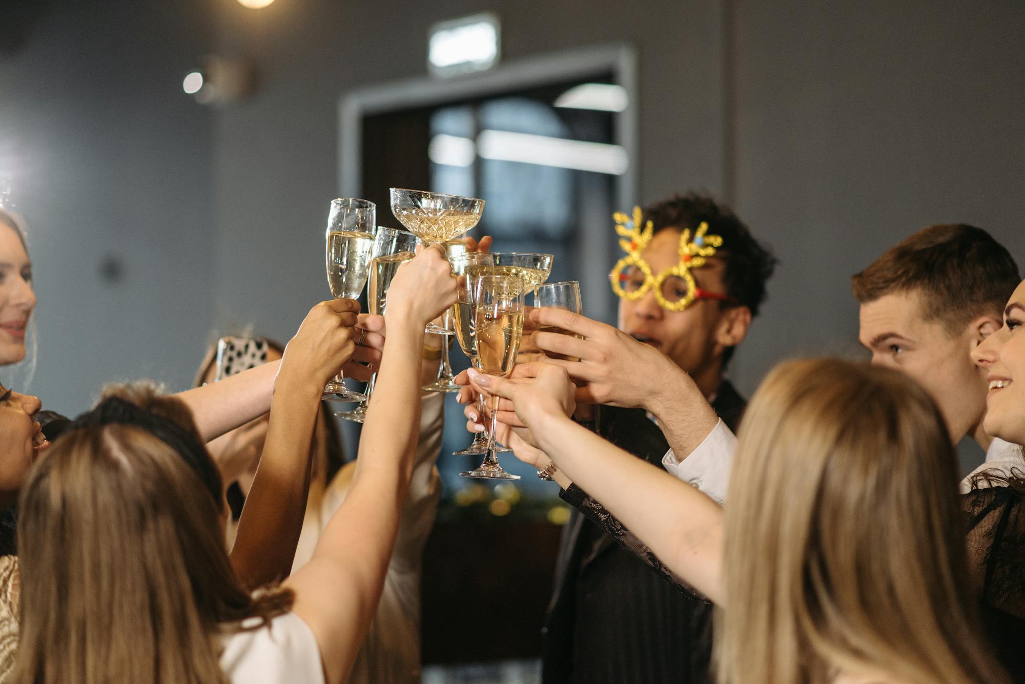 Group toasting champagne glasses at a celebration